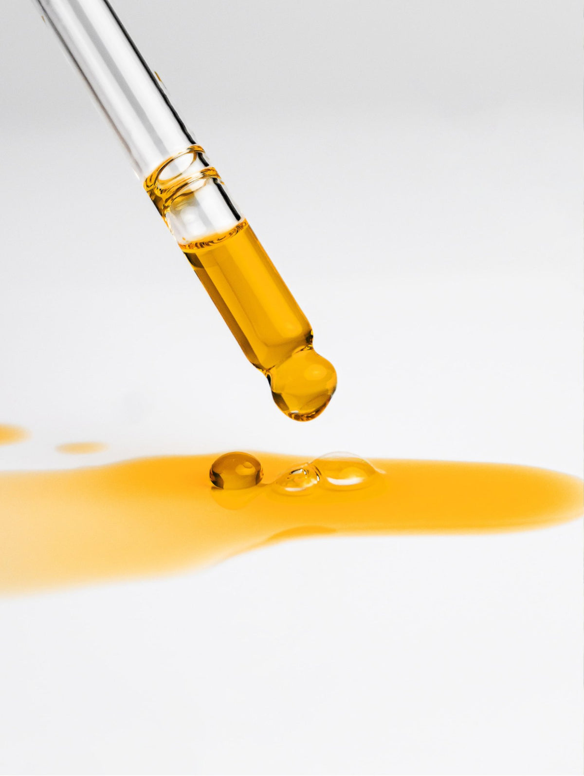 Facial Oil dropper with a drip of oil