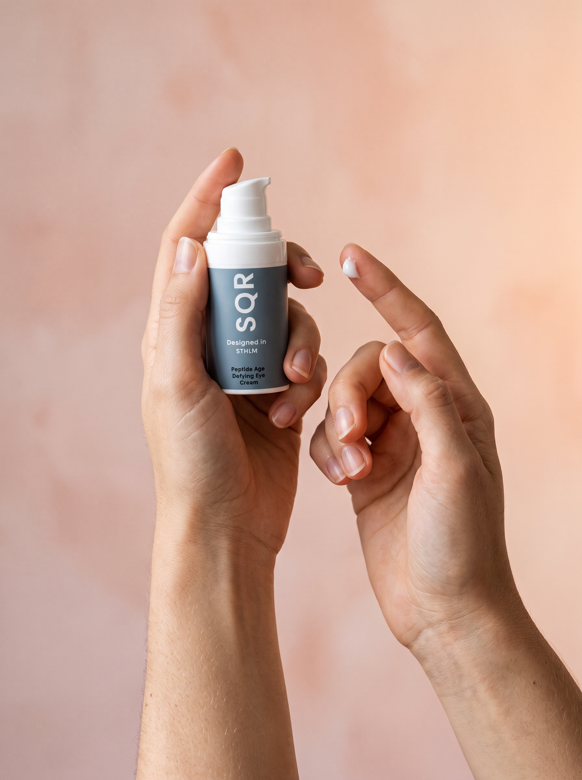 Peptide Eye Cream held in hands