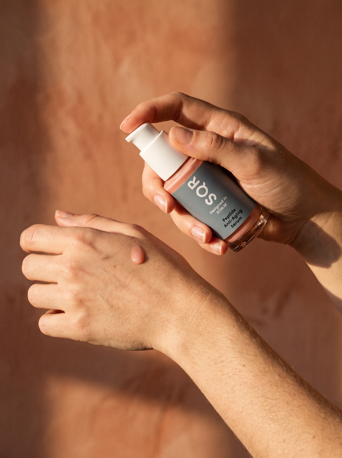 Peptide Serum applied to the back of the hand